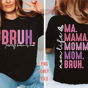 May include: A black t-shirt with a pink and purple graphic that says "BRUH. formerly known as mom" on the front and "mom life MA. MAMA. MOMMY. MOM. BRUH." on the back.