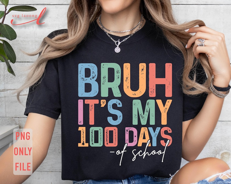May include: A black t-shirt with the text "Bruh it's my 100 days of school" in colourful, distressed lettering.