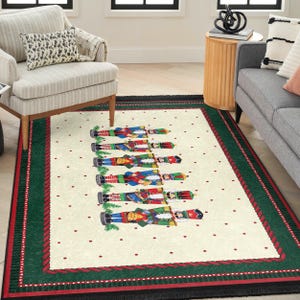 May include: A white and green Christmas rug with a red border. The rug features a row of nutcracker figurines in various colors and designs.