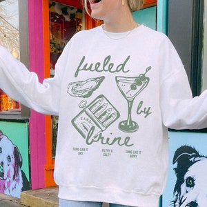 fueled by brine. Dirty martini sweatshirt.