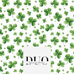 May include: A white background features a pattern of green shamrocks in different sizes. The shamrocks are shaded to appear realistic. The text "DUO Designed Studio" is in the lower right corner of the image.