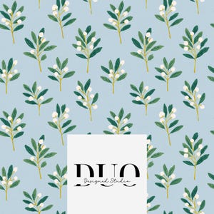 May include: A light blue background featuring a repeating pattern of green leafy branches with small white berries. A white rectangular overlay in the center displays the black text DUO Designed Studio in a serif and script font combination.