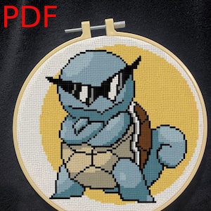 May include: A blue and brown cross-stitch embroidery of a cartoon turtle wearing sunglasses. The turtle is sitting on a yellow background.