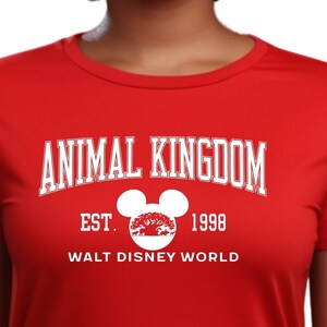 a woman wearing an animal kingdom t - shirt