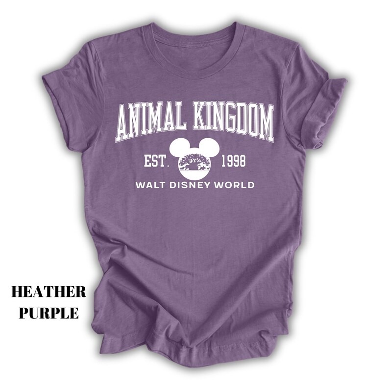 a purple shirt with an animal kingdom logo on it