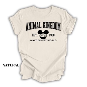a white shirt with an animal kingdom logo on it