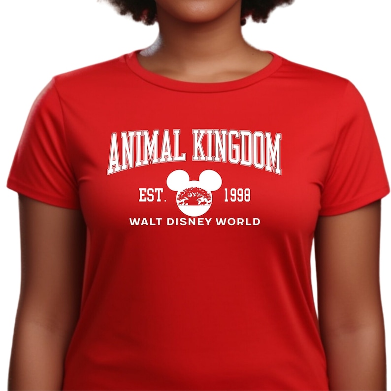 a woman wearing an animal kingdom t - shirt