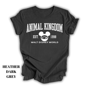 a black shirt with an animal kingdom logo on it