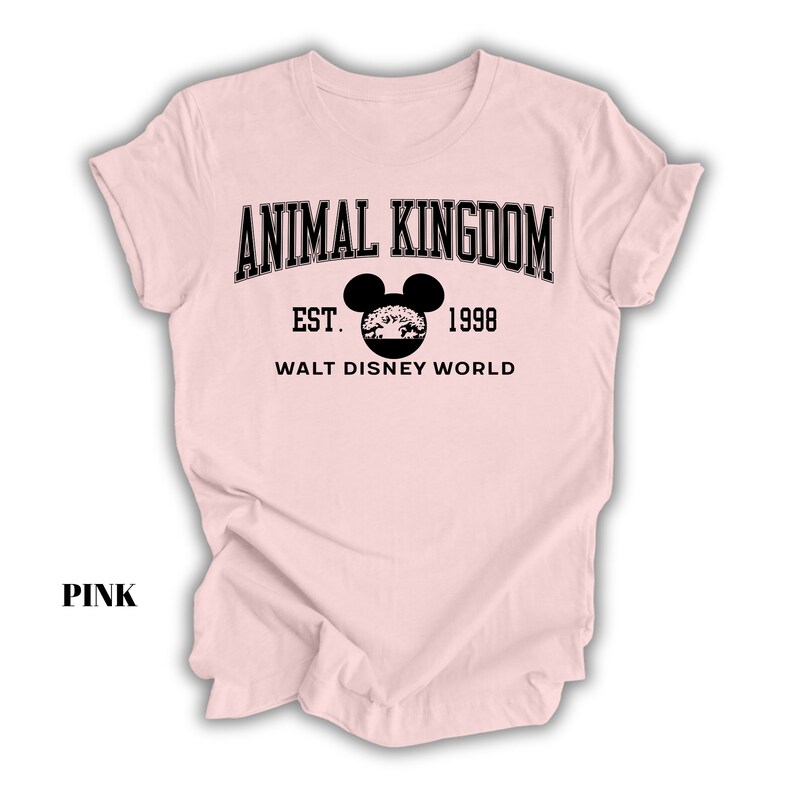 a pink shirt with an animal kingdom logo on it