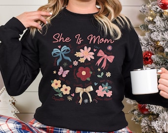She Is Mom Sweatshirt, Religious Mom Sweatshirt, Mom Bible Verse Hoodie, Floral Coquette Bow Mom Hoodie, Mother's Day Crewneck 125556