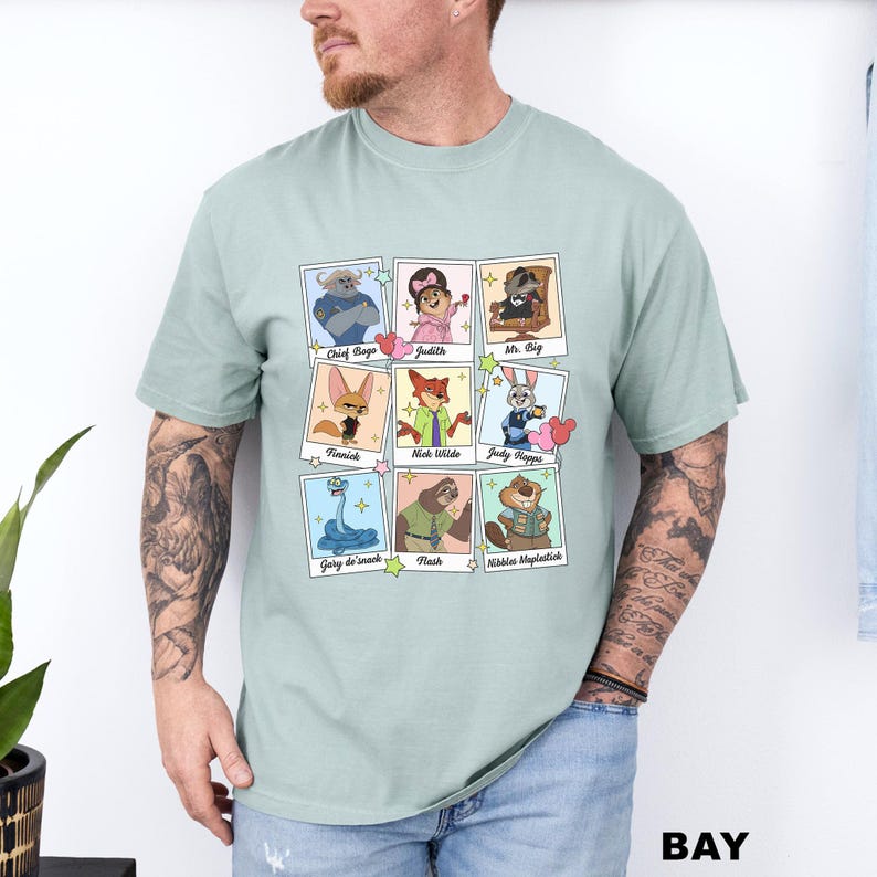 A man wearing a t-shirt with a graphic design of nine cartoon animal characters arranged in a 3x3 grid.