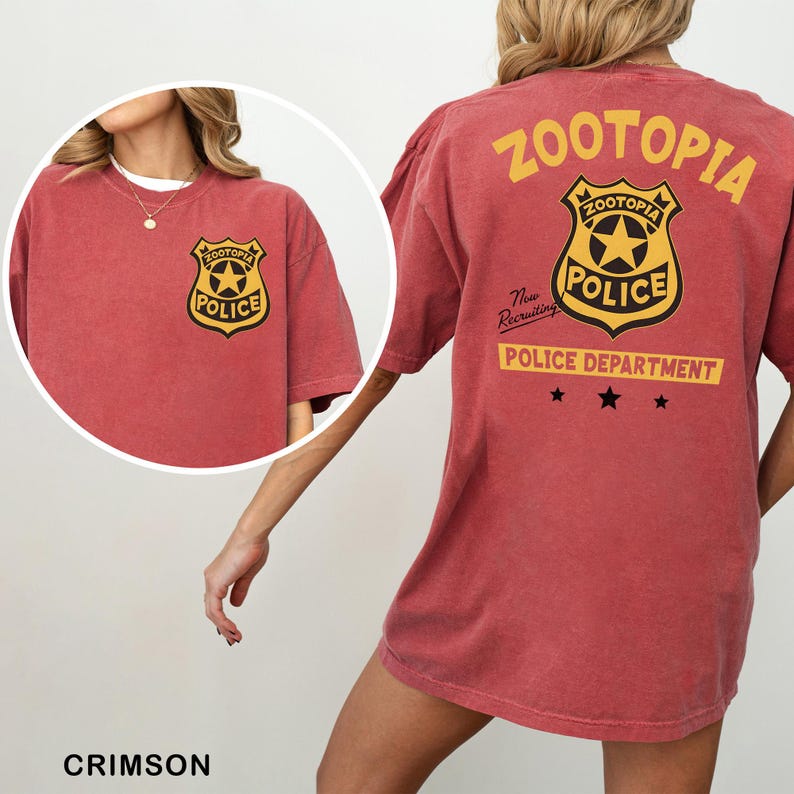 A red t-shirt with a police department logo and text, including the words "Zootopia Police Department" and "The newly appointed Police Department".