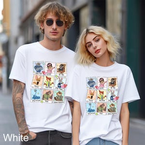 A man and a woman wearing white t-shirts with a collage of cartoon characters printed on them, standing together on a city street.
