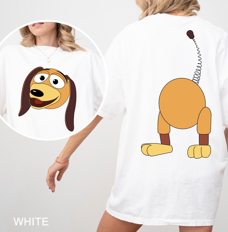 a woman wearing a t - shirt with a cartoon dog on it