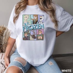 a woman wearing a white t - shirt with frozen characters on it