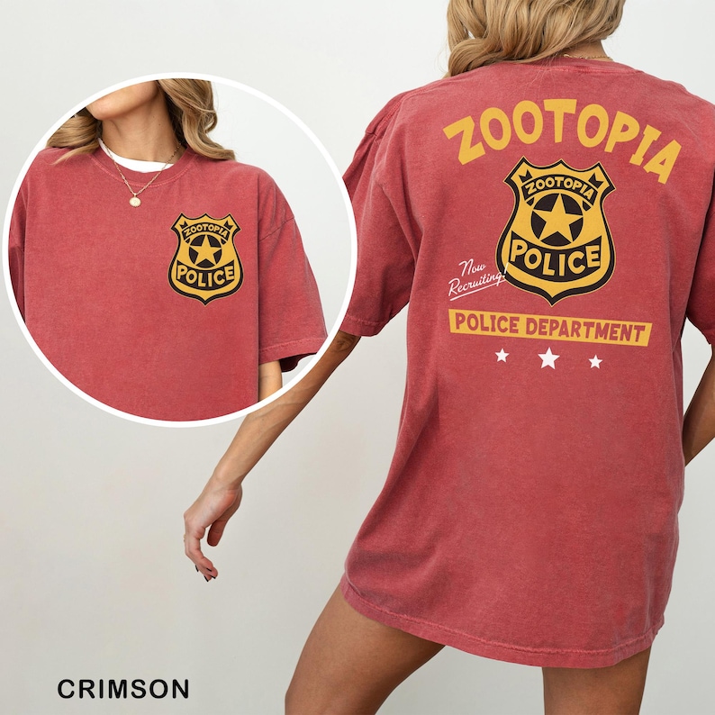 A red t-shirt with a police department logo and text, including the words "Zootopia Police Department" and "The New Recruiting Police Department".