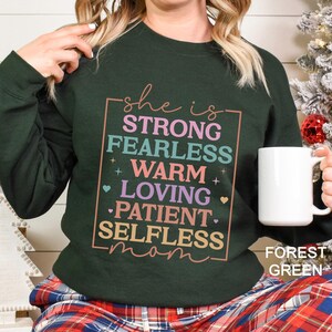 She is Strong Fearless Warm Loving Patient Selfless Mom Sweatshirt, Mother's Day Hoodie, Inspirational Mom Hoodie, Cute Mom Crewneck 125808