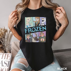 a woman wearing a black t - shirt with the words frozen on it