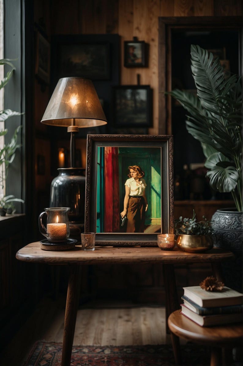 May include: A vintage-style framed painting of a woman standing in a doorway with a red curtain behind her. The painting is on a wooden table with a lamp, candles, and books.
