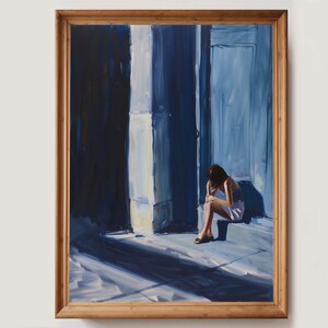 May include: A painting depicting a person seated in a blue room with a doorway. The person is wearing a white dress and has their head bowed. Light streams in from the left, creating shadows on the floor.