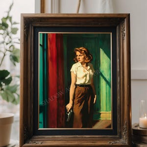 May include: A framed painting depicting a woman in a white shirt and brown trousers standing in a doorway. The woman is holding a gun in her right hand. The painting is set against a backdrop of a red curtain and a green door.
