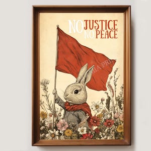 May include: Framed art print featuring a rabbit holding a red flag amidst wildflowers. The rabbit wears a gray suit and red scarf. The words "NO JUSTICE NO PEACE" are printed above the flag in red and white.