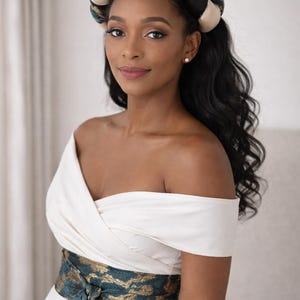 May include: A set of three ceramic mugs with a speckled, matte finish. The mugs are in shades of cream, light gray, and dark gray. Each mug has a simple, minimalist design and a rounded handle.