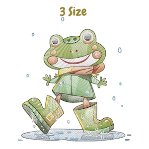 Könnte beinhalten: Stickerei mit einer grünen Frosch, die eine grüne Jacke, einen roten Schal und gelbe Stiefel trägt und in einer Pfütze steht. Der Text "3 Size" befindet sich über dem Frosch.