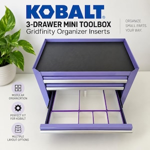May include: A purple Kobalt 3-drawer mini toolbox with a black top surface and silver drawer pulls. The bottom drawer is open, revealing white Gridfinity organizer inserts with multiple compartments for small parts storage and organization.