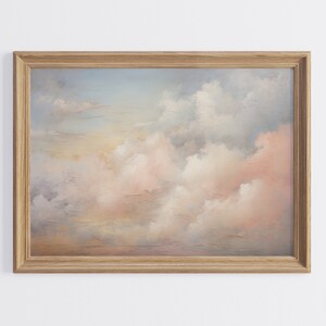 Pode incluir: Uma pintura emoldurada de um céu suave e sonhador com nuvens cor-de-rosa e brancas. As nuvens são pintadas em um estilo realista, e o céu é de um azul claro. A pintura é emoldurada em uma moldura de madeira simples.
