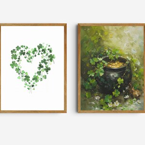 May include: Two framed prints with a St. Patrick's Day theme. The first print features a heart shape made of green shamrocks. The second print shows a pot of gold with shamrocks growing around it.