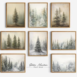 May include: A collection of eight framed art prints featuring watercolor paintings of misty forest scenes. The artwork showcases various compositions of evergreen trees in muted green and gray tones, with a soft, atmospheric quality. The frames are a warm, natural wood color.