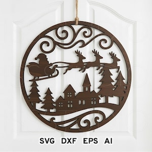 May include: A round, brown wooden Christmas decoration featuring Santa Claus in a sleigh pulled by reindeer over a village scene. The design includes pine trees and decorative swirls. The text "SVG DXF EPS AI" is at the bottom.