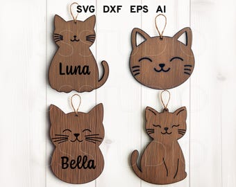 May include: Four wooden cat ornaments with smiling faces. Two of the ornaments have the names "Luna" and "Bella" written on them.