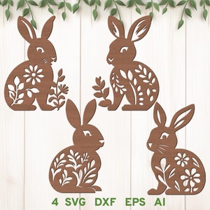 Könnte beinhalten: Vier braune Silhouette-Ausschnitte von Hasen mit Blumendesigns. Die Hasen sitzen mit aufgestellten Ohren und geschlossenen Augen. Die Blumendesigns sind filigran und detailliert.