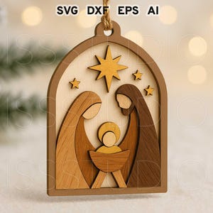 May include: Wooden Christmas ornament featuring a Nativity scene. The ornament has a layered design with a brown frame, a light wood background, and figures in shades of brown and gold. The text "SVG DXF EPS AI" is at the top.