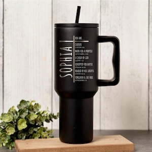 May include: Black insulated tumbler with a handle and a black lid, featuring the name "SOPHIA" vertically. The tumbler has inspirational text including "CHOSEN" and "MADE FOR A PURPOSE". Includes a black straw.
