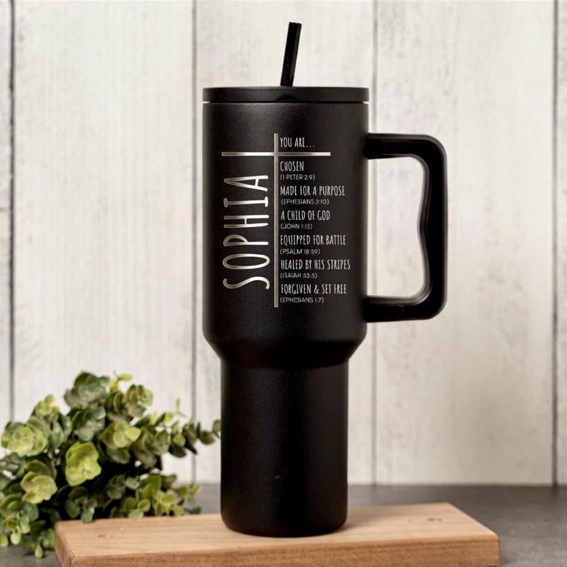May include: Black insulated tumbler with a handle and a black lid, featuring the name "SOPHIA" vertically. The tumbler has inspirational text including "CHOSEN" and "MADE FOR A PURPOSE". Includes a black straw.