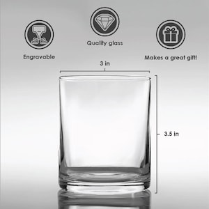 May include: A clear, cylindrical glass with a 3-inch diameter and a height of 3.5 inches. The glass is labeled as "Engravable" and "Makes a great gift!" It is made of quality glass.