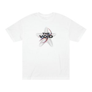 May include: White t-shirt with a black and white graphic of a star with the text "THE VOID" inside.