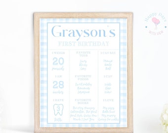 May include: A blue and white gingham patterned printable first birthday sign with the name Grayson. The sign includes details about Grayson's first year, such as his weight, length, and favorite foods.