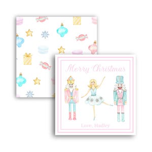 May include: A pink and white Christmas card with a watercolor illustration of a ballerina and two nutcrackers. The card says "Merry Christmas" and "Love, Hadley".