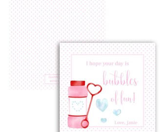 May include: Pink and white card with a pink and red bubble wand and bottle. The card says "I hope your day is bubbles of fun! Love, Janie".