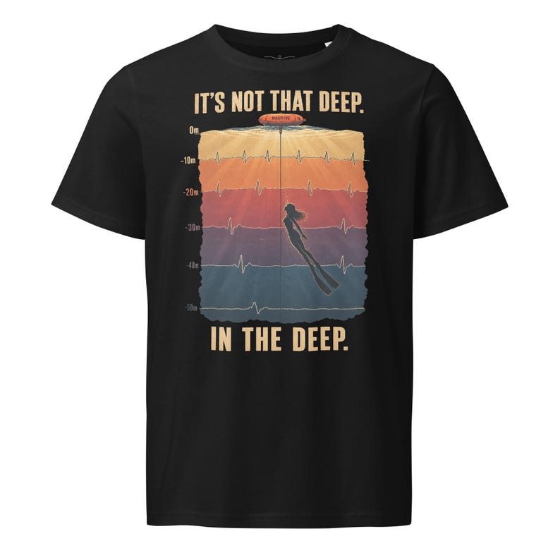May include: A black t-shirt featuring a graphic of a diver descending through water layers marked from 0m to 50m with heartbeat lines. The text reads IT'S NOT THAT DEEP. IN THE DEEP. The design includes a red buoy at the surface and a silhouette of a diver.