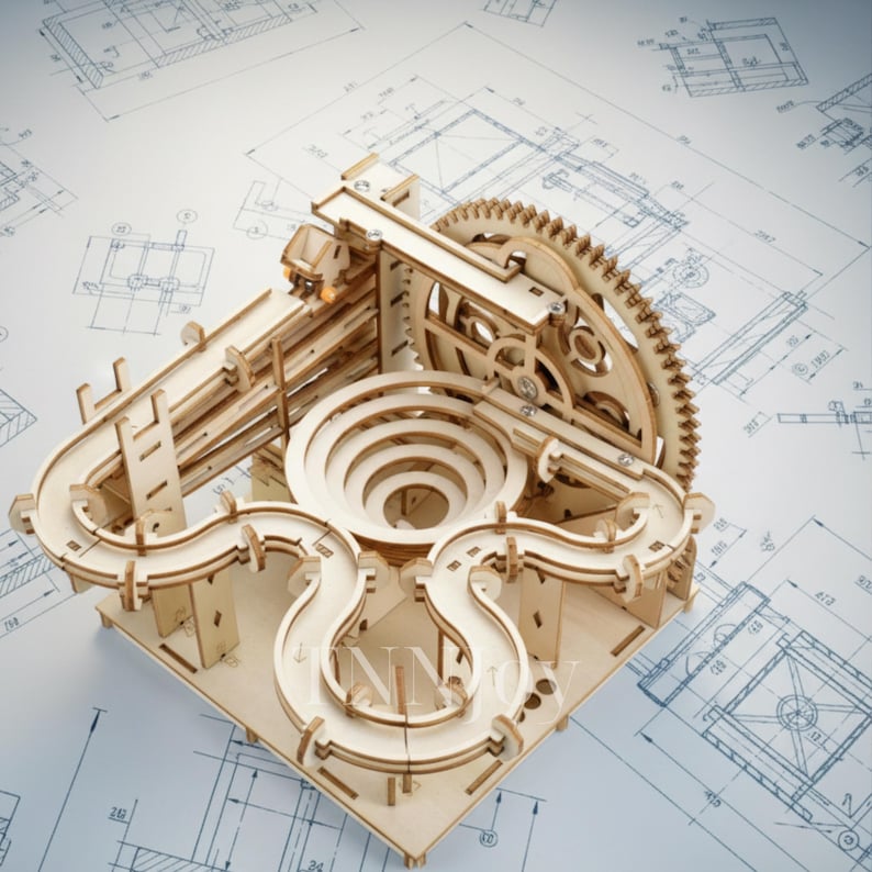 May include: A wooden marble run kit with a complex design featuring ramps, a spiral, and a large gear. The kit is made of light-colored wood and sits on a blueprint background. The marble run is a fun and engaging activity.