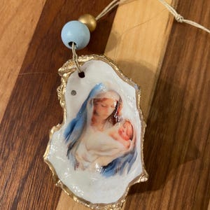 Decorazione a conchiglia con madre e bambino - Articolo n. 1621