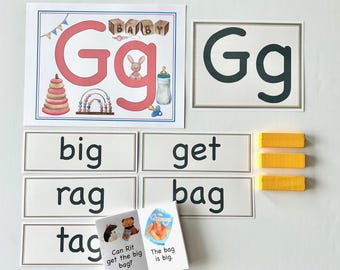 May include: Educational baby learning materials featuring the letter "G". Includes flashcards with the letter "G", words like "big", "get", and "bag", and small books with simple sentences. Also includes wooden blocks and illustrations of baby-related items.