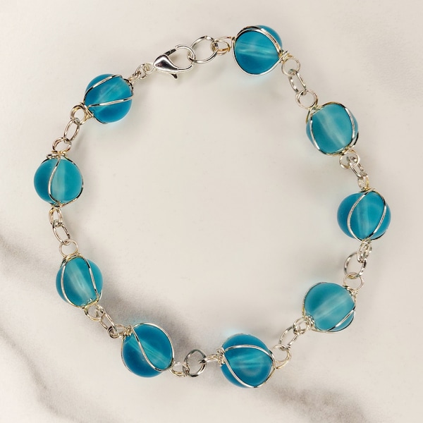 Handmade Silver Wire Wrapped Blue Glass Bead Bracelet with Lobster Claw Clasp.  Original Design