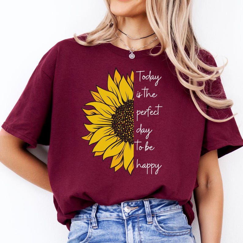 Positive quote shirt with sunflower graphic and motivational text printed on a soft gray sweatshirt. Perfect inspirational shirt for casual outfits, happy vibes, and everyday styling.