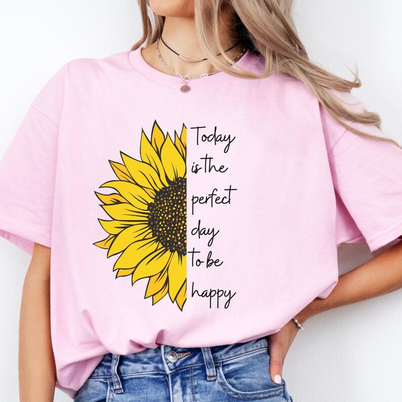 Floral graphic tee designed with sunflower illustration and positive quote printed on a cozy gray sweatshirt. Perfect for motivational outfits and relaxed casual wear.